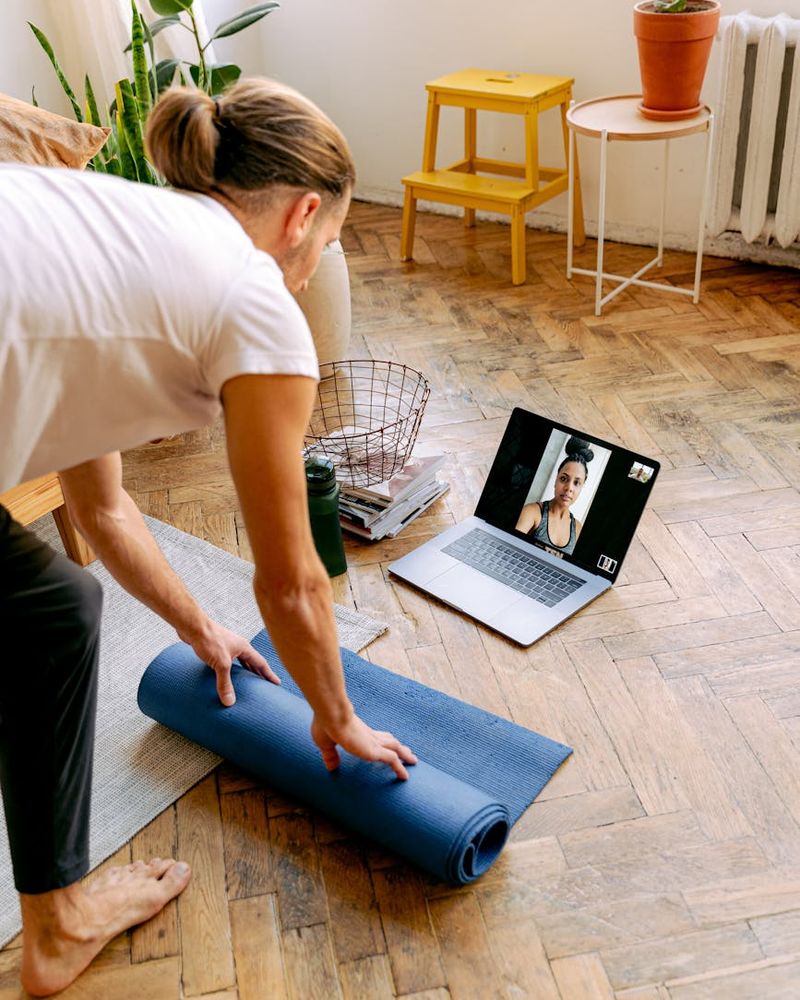 Bright and open room with yoga mats ready for an exercise session.
